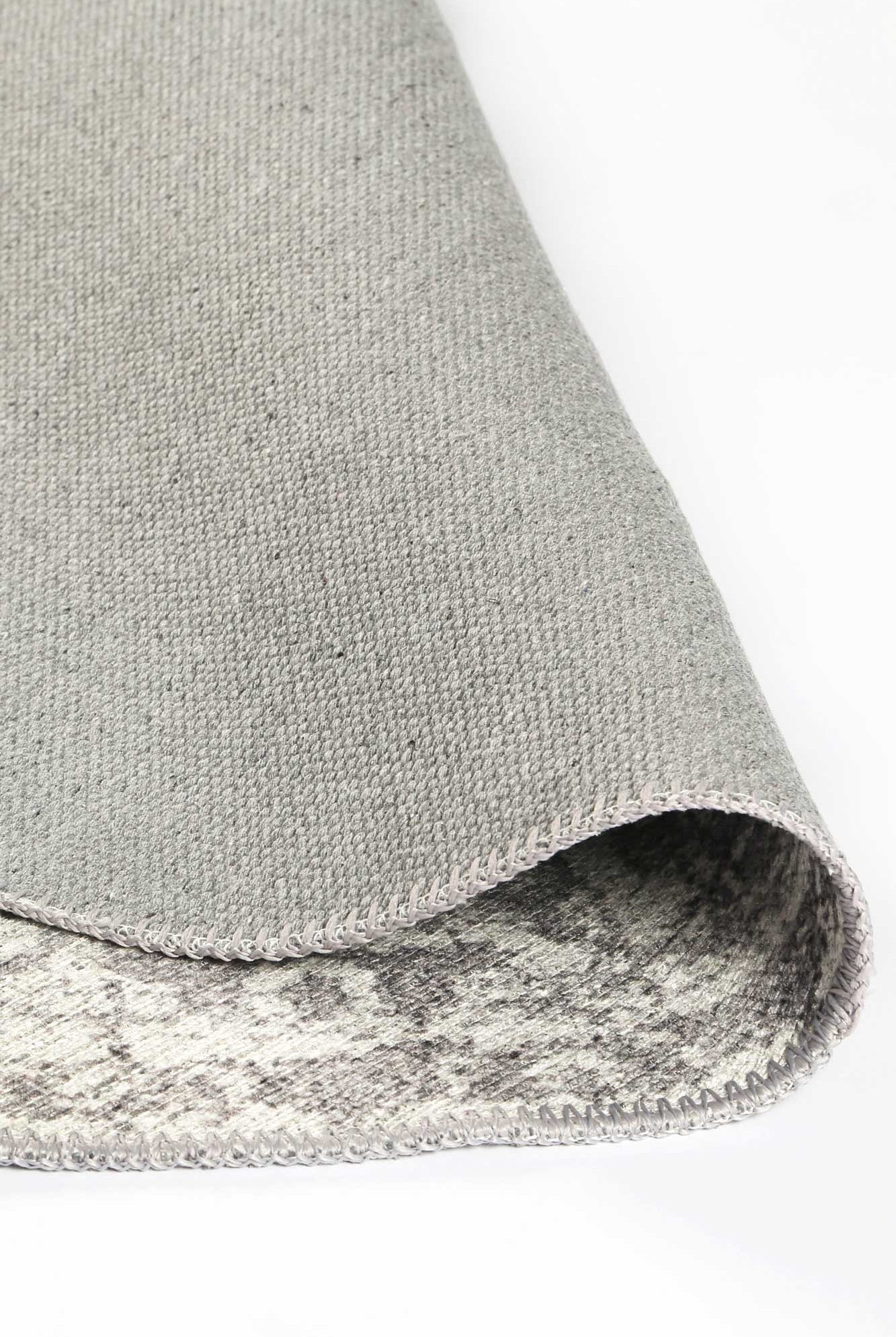 Distressed Vintage Chilaz Grey Round Rug folded