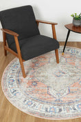 Load image into Gallery viewer, Distressed Vintage Pissarro Terracotta Sky Round Rug under table
